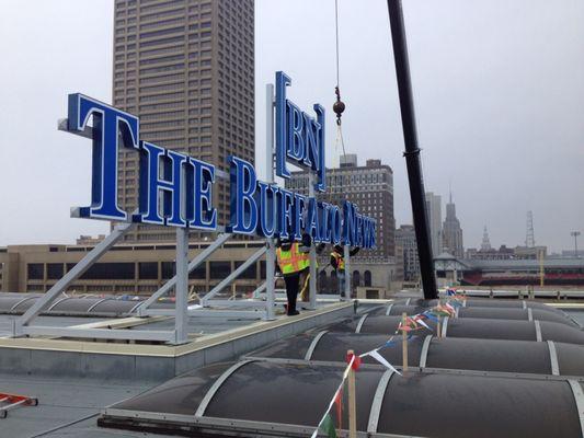 We built and installed this roof top sign on the Buffalo News building. Did all building signs and also the RGB LED neon railing lights.