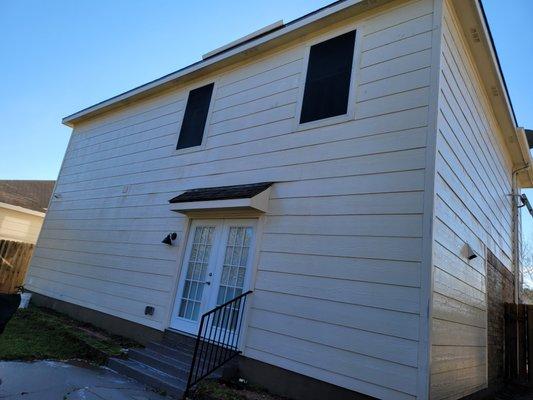 After the green algae is removed the house looks brand new again.