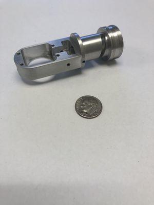 Lens actuator. Machined from aluminum. Tolerances to +/-.0005"