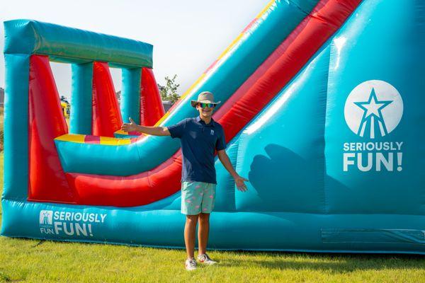 Declin posing in front of our giant obstacle course rental