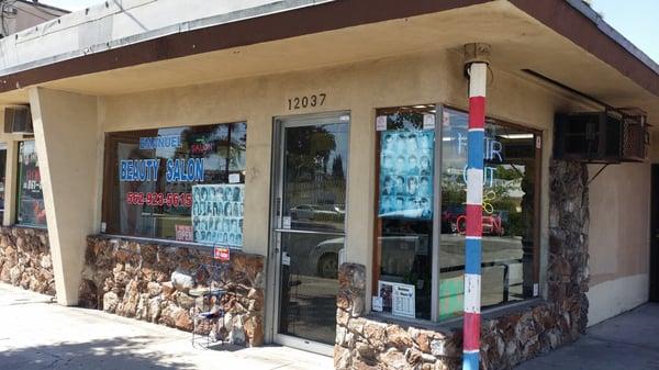 Exterior Emanuel Beauty Salon traveling south on Paramount Blvd. across from Shakey's Pizza.