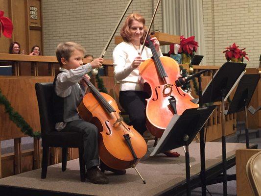 Playing with student Caleb for a Christmas program in 2016