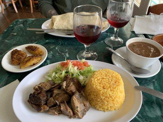 Pork with rice, beans, and some plantains. Jumbo pork burrito. Topped off with some Sangria