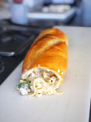 Chicken broccoli Alfredo stuffed into a 12inch sourdough sub.