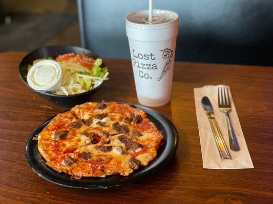 Here's an example of their daily lunch special... small 2-topping pizza, salad, and soda, all for $10.77 including tax.