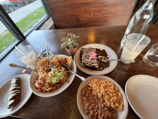 Loaded Al Pastor Nachos, Enmoladas with rice and beans and homemade Horchata