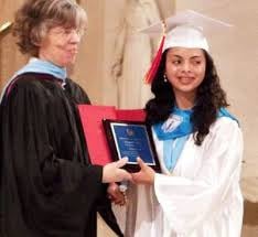 A graduating Seton senior gets her diploma.