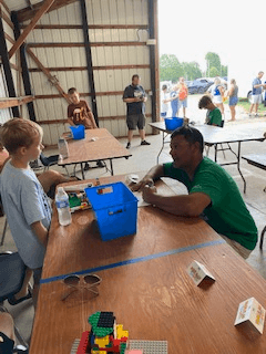 Market President Joe Horabik volunteering for the Lego contest at the fair.