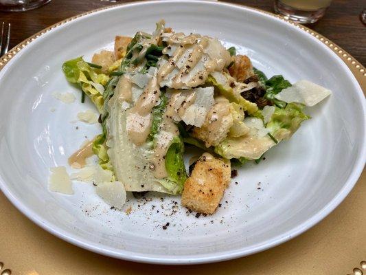 Caesar Salad served as part of the meal at a wedding reception.