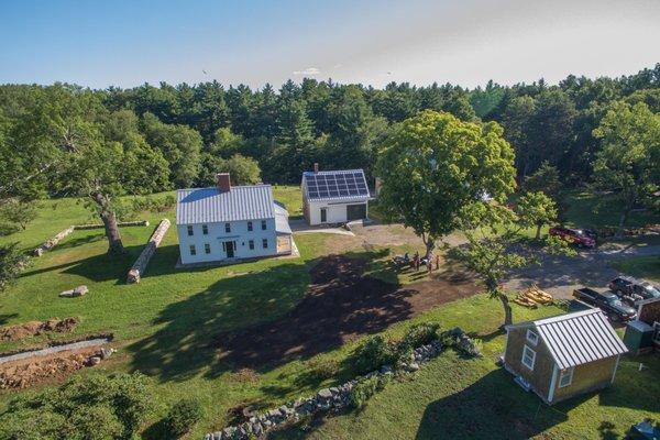 View of the farmhouse (left) and Carriage house (with solar panels).