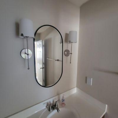 Install mirror in bathroom.