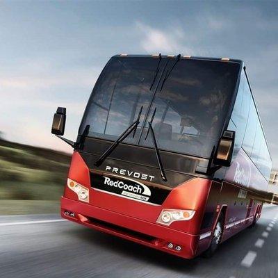 This Red Coach bus allows guests to ride headed out of town on a daily basis.