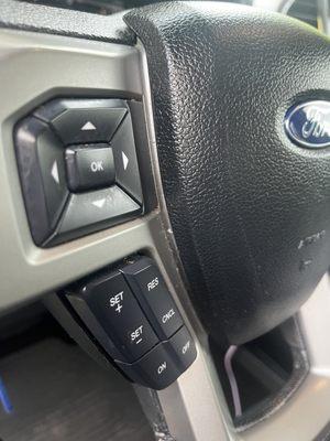 Post-detail - notice grime on buttons and dirt in crevices. A $575.00 detail would have steamed this steering wheel clean.