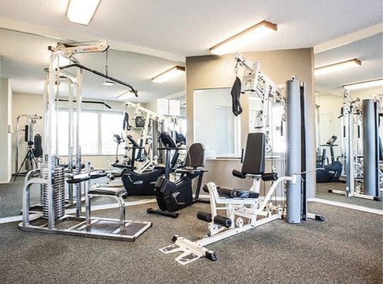 The modern fitness center at Sunset Park Apartments in Seattle, WA