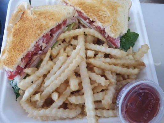 Club sandwich with fries