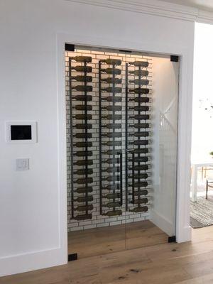 Custom designed wine room made with ultra clear glass