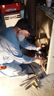 Owner - Leon King wiring a new gas conversion burner.