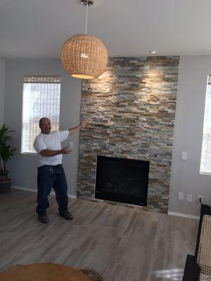 one of my recent projects.  Stone on the wall of the fireplace and two recessed lights on the ceiling pointing at the wall