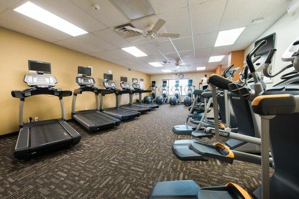 Cardio room featuring Treadmills, ellipticals, AMT's, Recumbent Bike, Standard Bike, and Stairmill. Personal TV's on most equipment!