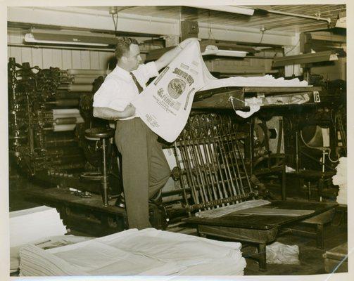 Clarence Elsas with a Fulton Bag and Cotton Mills bag, [1953 February]