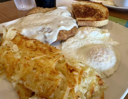 Hash browns, over easy eggs, cfs, toast