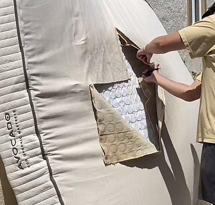 my boyfriend cutting off the mold on the mattress