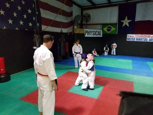 Little girls learning to spar