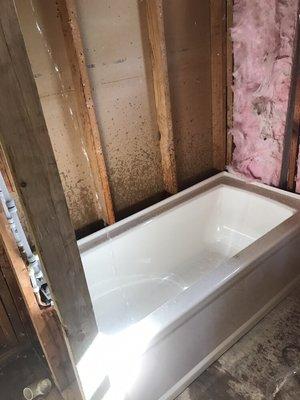 This is a picture of a tub we installed. If you notice has new PEX water lines with a new tub and shower valve.