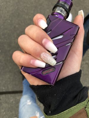 Pink to white ombré with a glitter accent nail and matte top coat