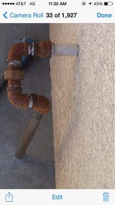 Rusty non-sleeved pipe installed by Priest Masonry with no shut off access...