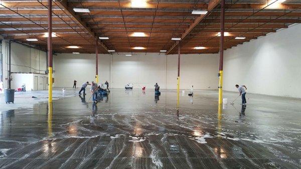 Scrubbing warehouse concrete floors