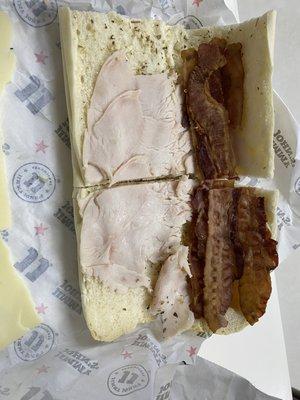 This is all the meat on a sandwich.   No mayo packets to be found or on the sandwich.   The turkey doesn't even cover the bread!!