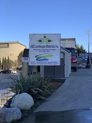 Sign showing hours and the entrance (it is just before the dump)