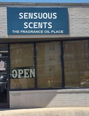 open storefront, sign reads "sensuous scents"