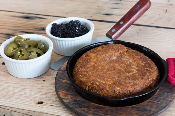 Cast Iron Cornbread with a Blackberry-Sorghum Jam, Pickled Jalapenos, and Honey Butter