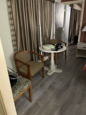 Table and chairs in Ling Bed Bath room. Adjoining room open.