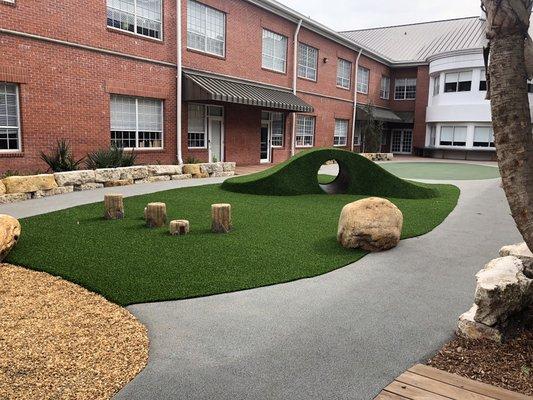 Innovative playground design? Our custom playground mounds with ForeverLawn Playground Grass have got you covered!