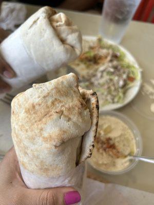 Falafel sandwiches and hummus. Background picture of  Chicken Gyro Over Rice