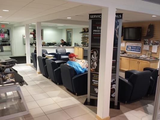 Comfortable waiting area with drinks, snacks, television, and free wi-fi for you to enjoy while servicing your vehicle!