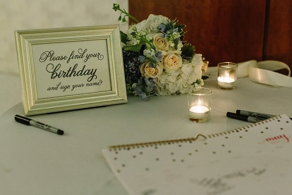 Flowers by BrookHill! Lovely accent on the guestbook table! Photo from James Ton Photography.