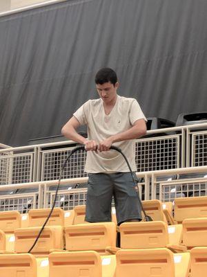 Shifter helping set up the Kennesaw State University Convocation Center for the Commencement Ceremony