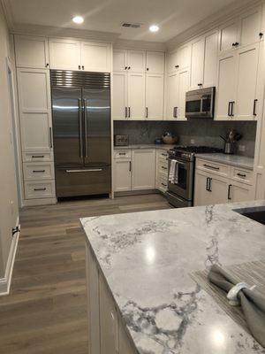 Custom Mouser kitchen in China white. Enlarged kitchen area. Extra deep cabinets.