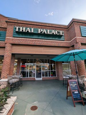 Outside Thai Palace, the Thai restaurant located at Glenwood Square shopping center, Chapel Hill. I took this storefront photo on 10/3/2023.