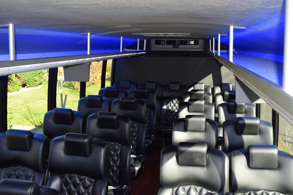 28 passenger bus with Bentley leather seats, USB/ outlet plugs by every seat, TV, DVD