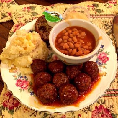 Meatballs, cheesy potatoes, bake beans, chocolate banana bread.