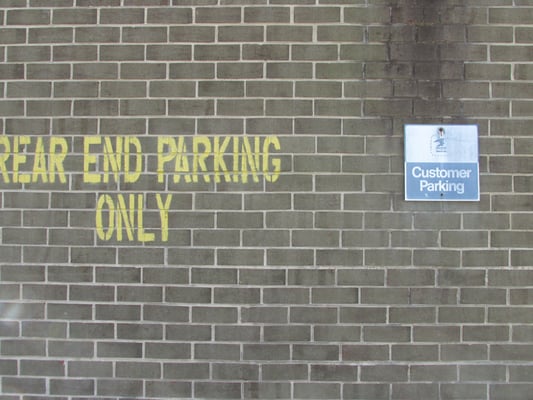 rear end parking into narrow spaces at this Post Office challenges even good drivers