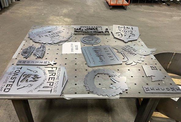 Weld table for sale along with laser cut signs