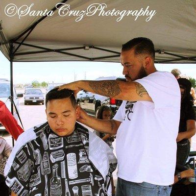 Tyrone doing some designs at rise and shine car show.