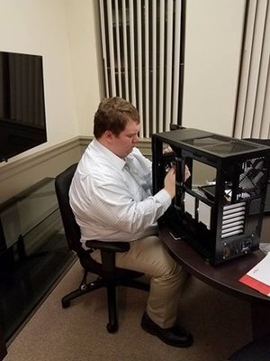 We do it all! Joey building a computer for accounting work.