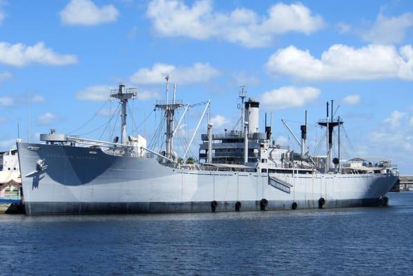 Waterside-view of American Victory WWII merchant ship. Port of Tampa HQ is to your right. Aquarium is behind the ship.